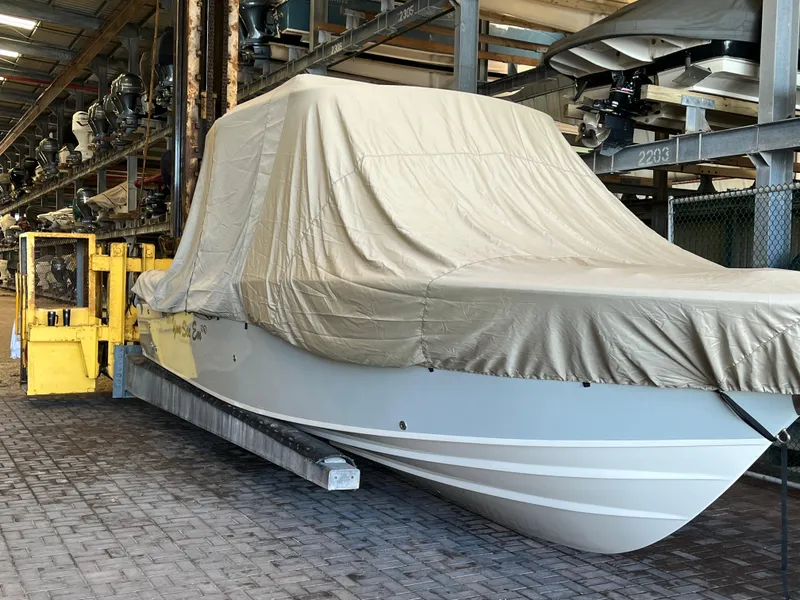 Slide: The Image of 2023 Grady-White Freedom 275 boat covered in storage facility. - 13