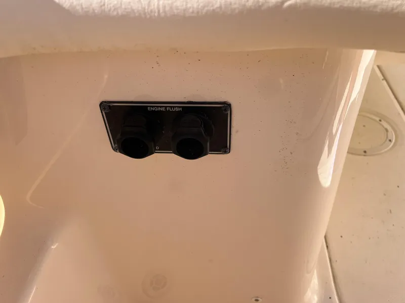 Slide: The Image of 2023 Grady-White Freedom 275 engine flush ports on boat deck. - 14