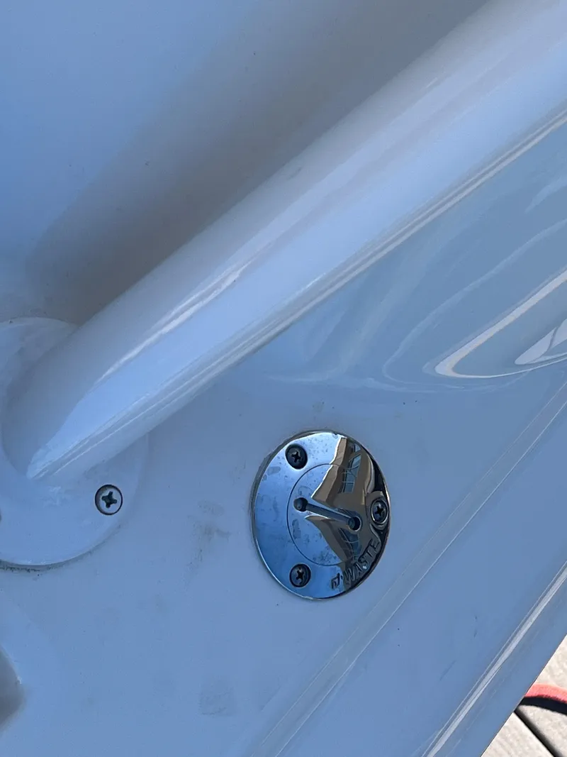 Slide: The Image of Close-up of a 2023 Grady-White Freedom 275 boat detail, featuring a metal fitting. - 15