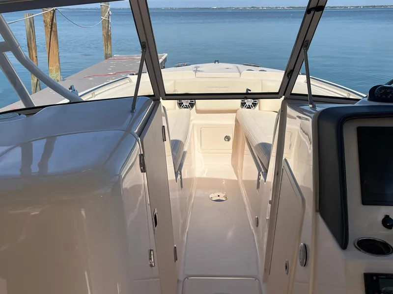 Slide: The Image of 2023 Grady-White Freedom 275 boat interior with open deck and water view. - 23