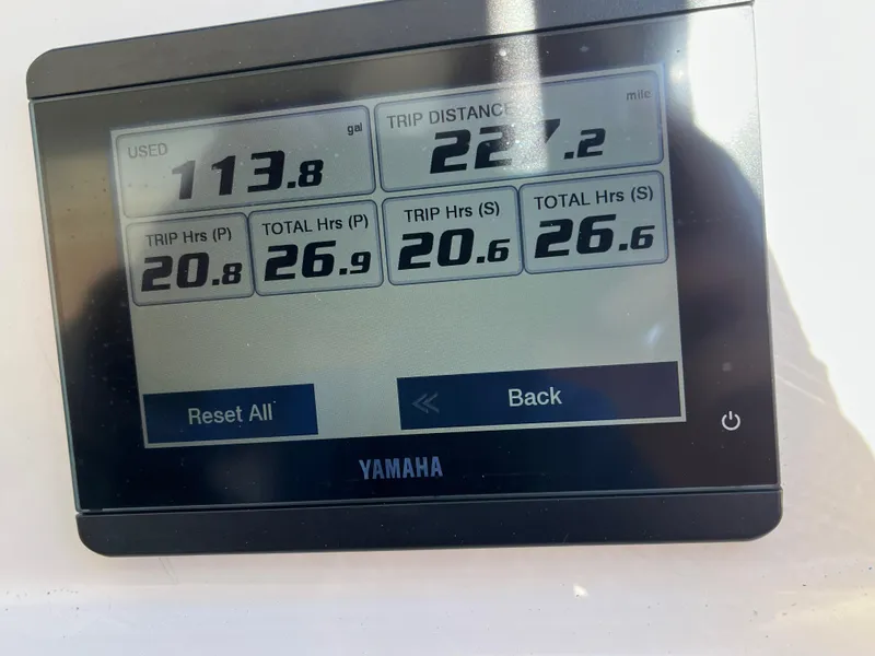 Slide: The Image of Yamaha display showing fuel usage and trip data for 2023 Grady-White Freedom 275. - 28