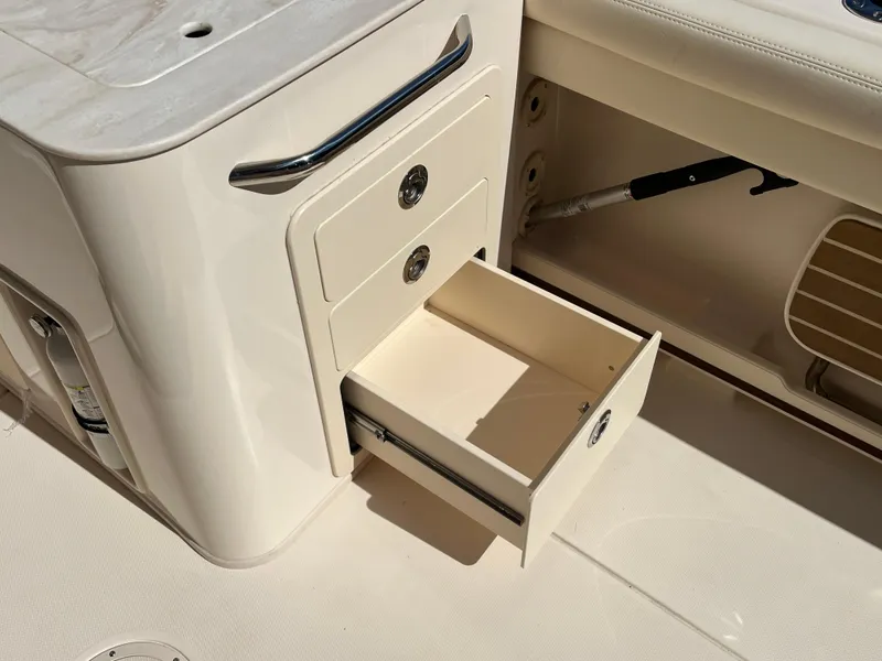 Slide: The Image of Open storage drawer on 2023 Grady-White Freedom 275 boat interior. - 29