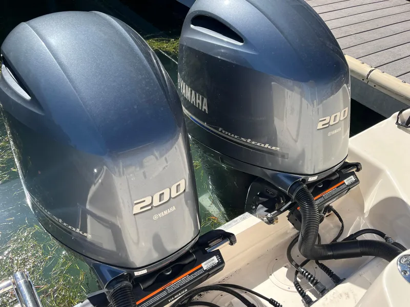 Slide: The Image of Twin Yamaha 200 outboard engines on a 2023 Grady-White Freedom 275 boat. - 4