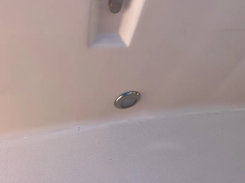 Slide: The Image of 2023 Grady-White Freedom 275 boat interior detail with chrome fixture. - 7