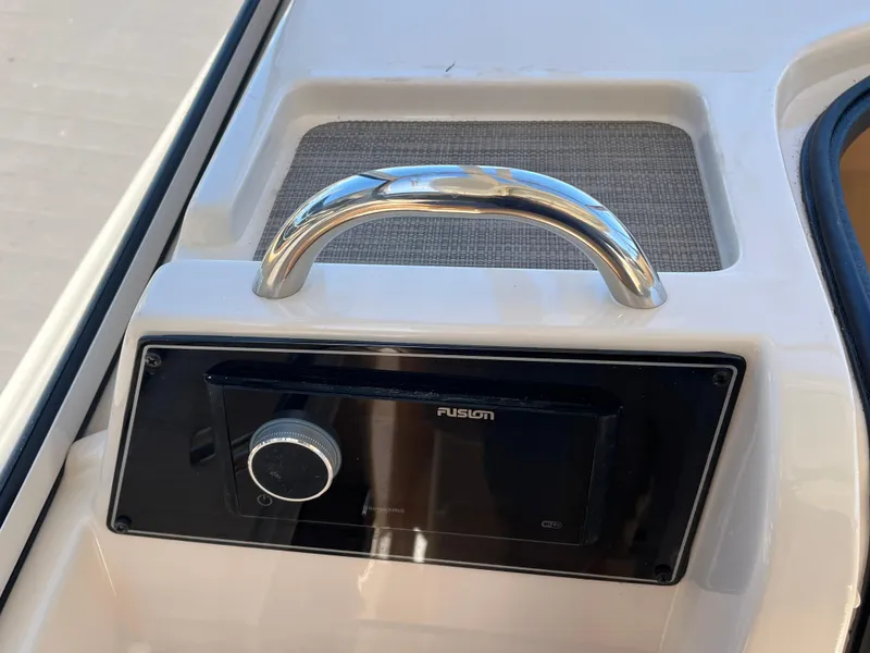 Slide: The Image of 2023 Grady-White Freedom 275 boat audio system with chrome handle. - 9