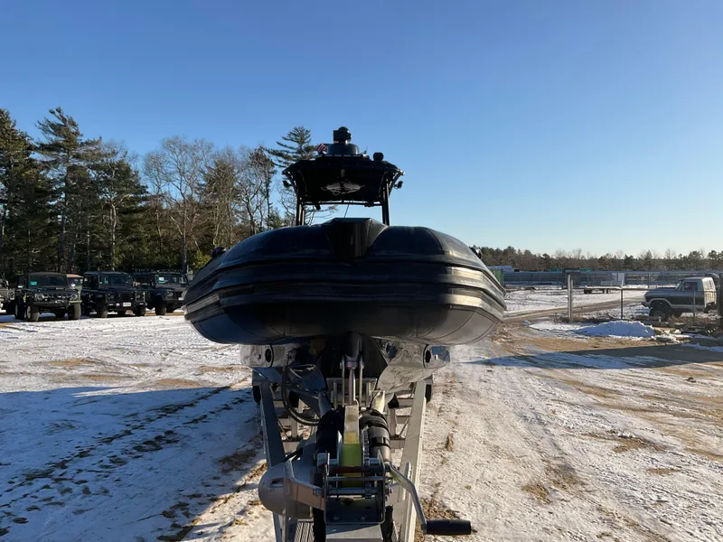Slide: The Image of Ocean Craft Marine 9.5 M boat, 2017 model, on trailer in snowy outdoor setting. - 10