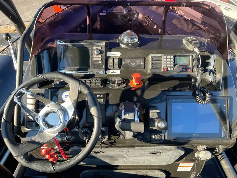 Slide: The Image of Control panel of a 2017 Ocean Craft Marine 9.5 M boat with navigation equipment. - 14