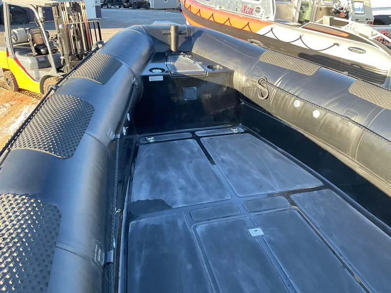 Slide: The Image of 2017 Ocean Craft Marine 9.5 M boat interior with durable flooring and inflatable sides. - 16