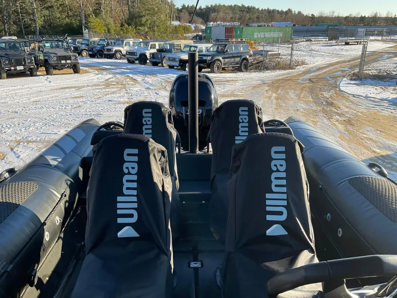Slide: The Image of Ocean Craft Marine 9.5 M boat, 2017 model, with Ullman seats, parked in snowy lot. - 17