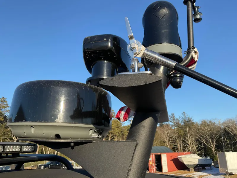 Slide: The Image of Radar and communication equipment on a 2017 Ocean Craft Marine 9.5 M boat under clear blue sky. - 18