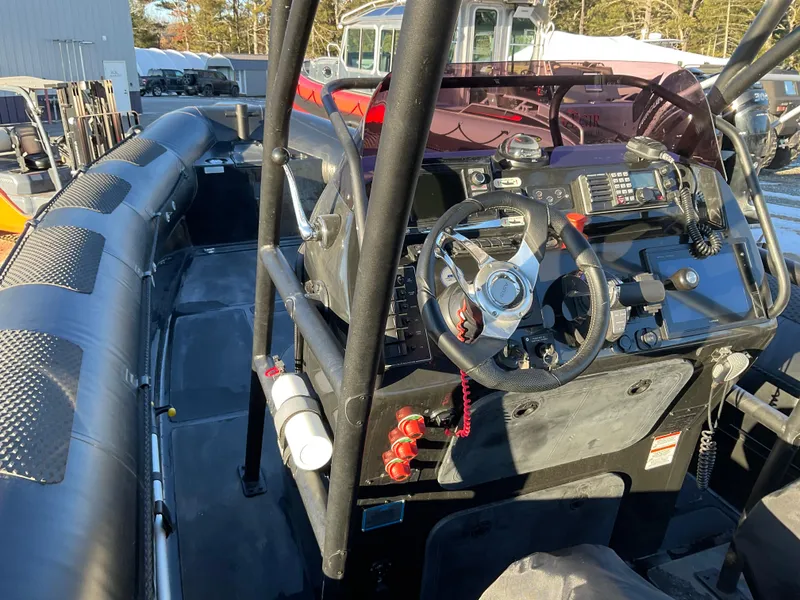 Slide: The Image of 2017 Ocean Craft Marine 9.5 M boat interior with steering wheel and control panel. - 21