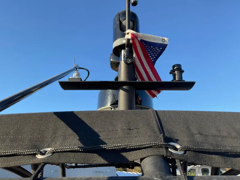 Slide: The Image of Ocean Craft Marine 9.5 M boat, 2017 model, with American flag, under clear blue sky. - 23