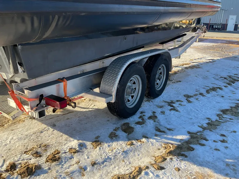 Slide: The Image of Trailer carrying 2017 Ocean Craft Marine 9.5 M boat on snowy ground. - 25
