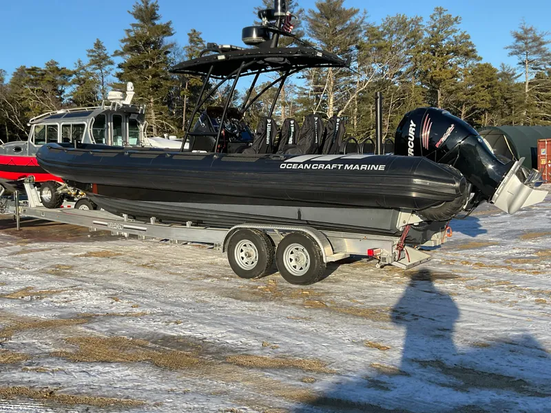 Slide: The Image of 2017 Ocean Craft Marine 9.5 M boat on trailer, parked outdoors. - 29