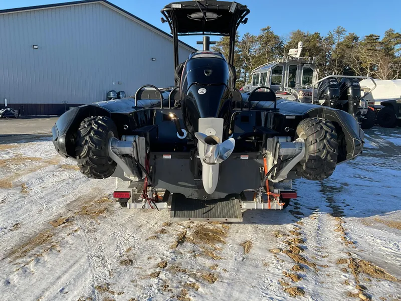 Slide: The Image of Ocean Craft Marine 9.5 M boat, 2017 model, on snowy ground near a building. - 3