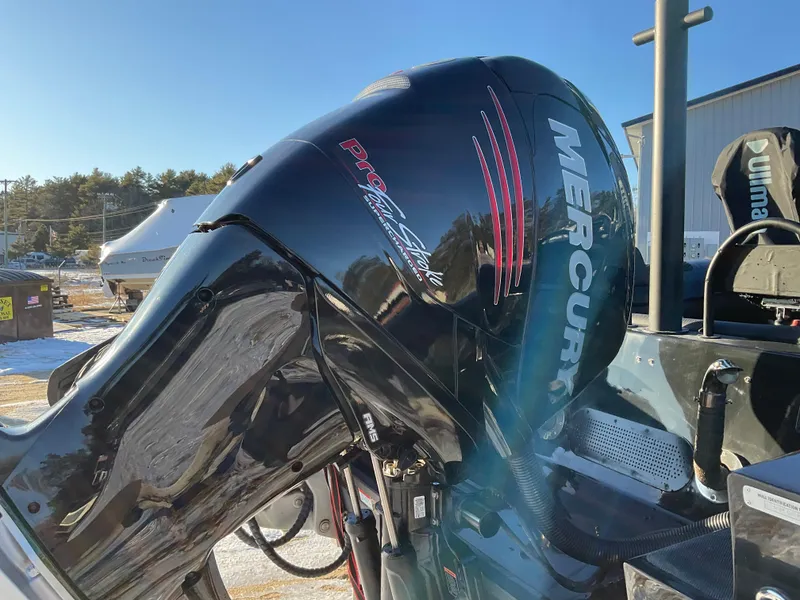 Slide: The Image of Mercury outboard engine on 2017 Ocean Craft Marine 9.5 M boat, outdoor setting. - 6