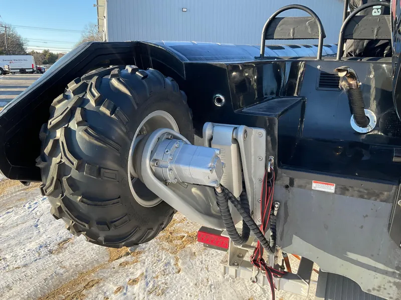 Slide: The Image of Close-up of a 2017 Ocean Craft Marine 9.5 M amphibious vehicle wheel on snowy ground. - 7