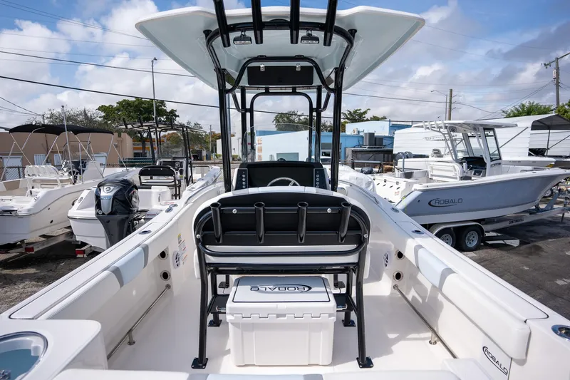 Slide: The Image of 2025 Robalo R230 Center Console boat, featuring spacious deck and modern design. - 14