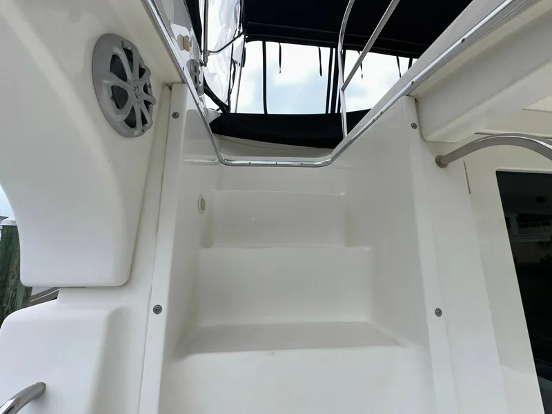 Slide: The Image of Staircase on 2007 Silverton 330 Sport Bridge yacht, featuring sleek white design and railing. - 10