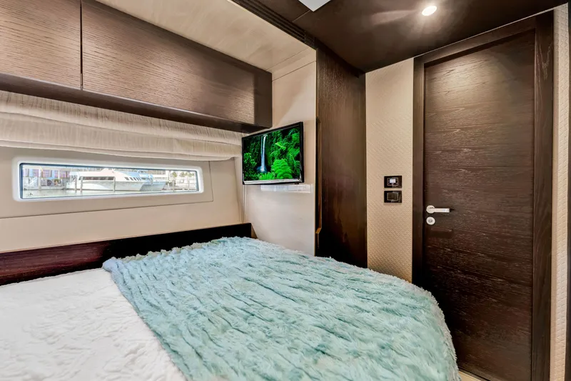 Slide: The Image of Luxurious bedroom interior of 2016 Azimut Fly 72 yacht with modern decor and window view. - 27