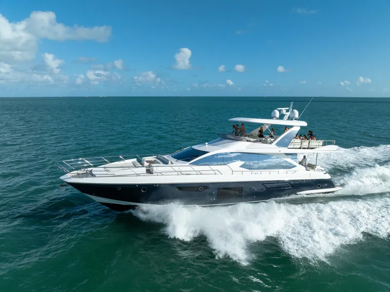 Slide: The Image of Azimut Fly 72 yacht cruising on open sea, 2016 model, under clear blue skies. - 3