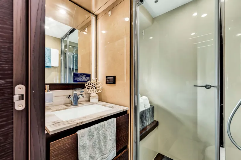 Slide: The Image of Luxurious bathroom in 2016 Azimut Fly 72 yacht, featuring modern fixtures and elegant design. - 48