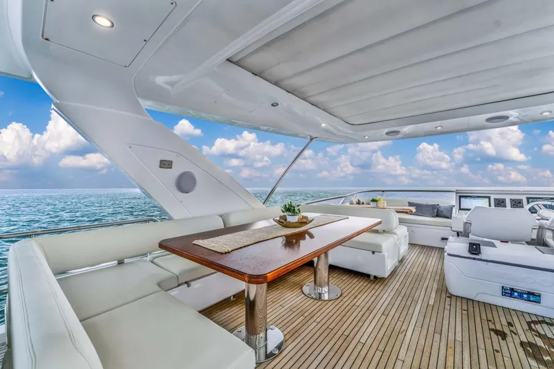 Slide: The Image of Luxurious 2016 Azimut Fly 72 yacht interior with elegant seating and ocean view. - 6