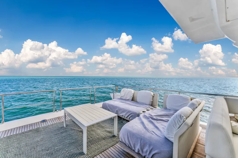 Slide: The Image of Luxurious Azimut Fly 72 yacht deck with ocean view, featuring comfortable seating, 2016 model. - 9