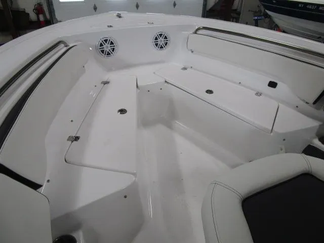 Slide: The Image of 2025 Tidewater 198 CC Adventure boat interior with seating and storage compartments. - 11