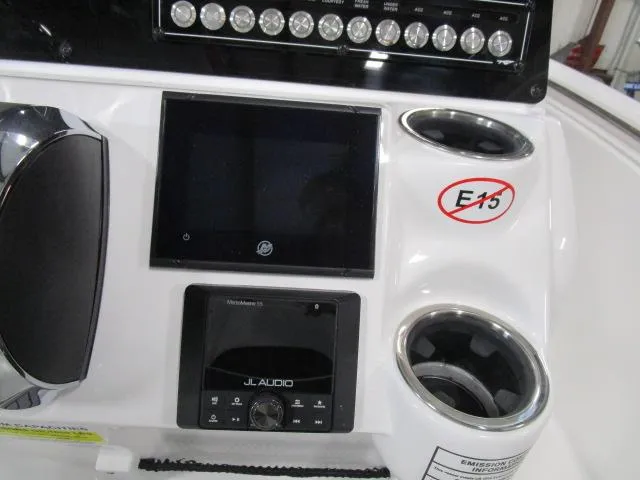 Slide: The Image of Control panel of 2025 Tidewater 198 CC Adventure boat with audio system and cup holders. - 13