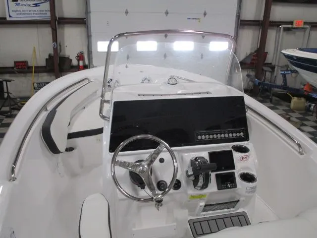 Slide: The Image of 2025 Tidewater 198 CC Adventure boat interior with steering wheel and control panel. - 4