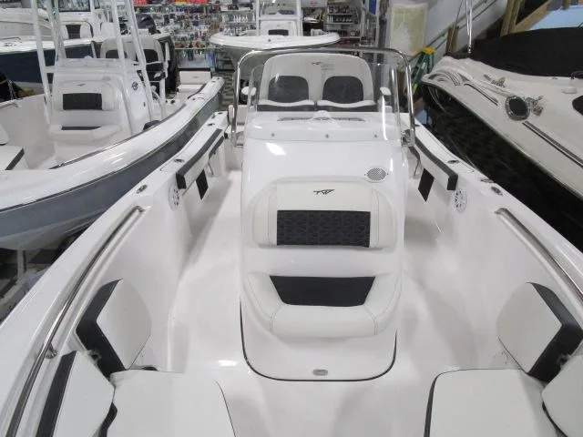 Slide: The Image of 2025 Tidewater 198 CC Adventure boat interior, featuring sleek white seating and modern design. - 5