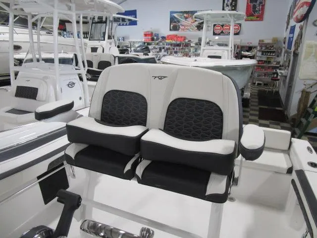 Slide: The Image of 2025 Tidewater 198 CC Adventure boat seats in showroom, featuring modern design and comfort. - 6