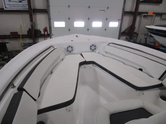 Slide: The Image of 2025 Tidewater 198 CC Adventure boat interior with white seating and speakers. - 7