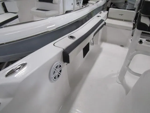 Slide: The Image of 2025 Tidewater 198 CC Adventure boat interior with seating and speaker detail. - 9