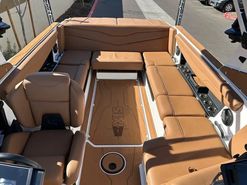 Slide: The Image of Luxurious interior of 2025 Axis T235 boat with tan leather seating. - 15