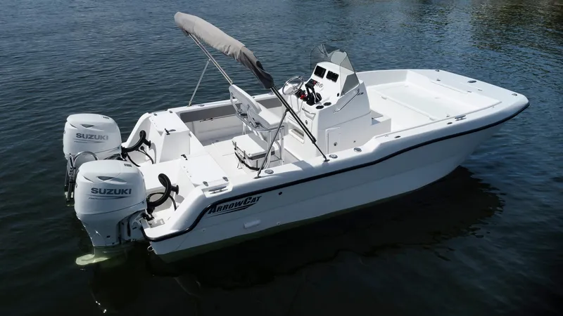 Slide: The Image of 2025 ArrowCat 20 CC boat with twin Suzuki engines on calm water. - 10