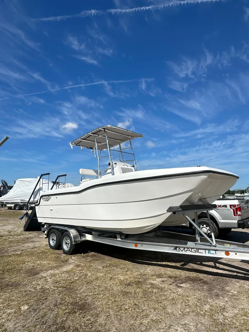 Slide: The Image of 2025 ArrowCat 20 CC boat on trailer under clear blue sky. - 11