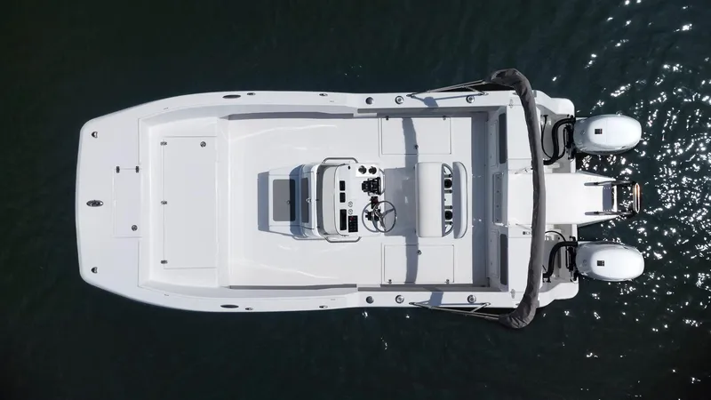 Slide: The Image of Aerial view of 2025 ArrowCat 20 CC boat on water, showcasing sleek design and dual engines. - 9