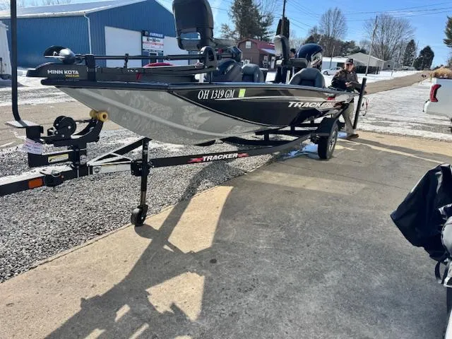 Slide: The Image of 2024 Bass Tracker Pro Team 175 boat on trailer, parked outdoors. - 10