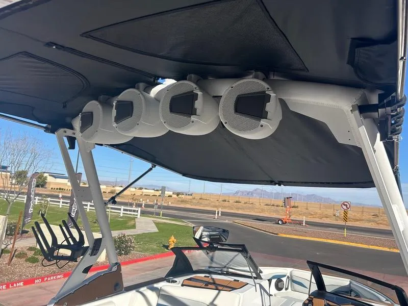 Slide: The Image of Axis T235 boat speakers and canopy, 2025 model, parked outdoors. - 11