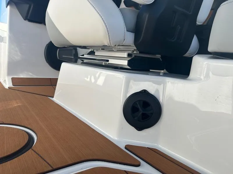 Slide: The Image of 2025 Axis T235 boat interior with white seating and wood accents. - 15