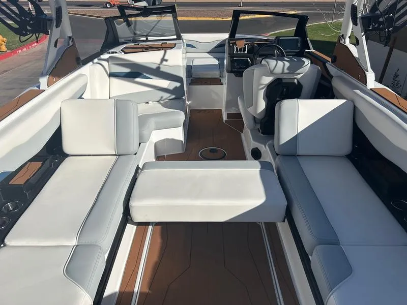 Slide: The Image of 2025 Axis T235 boat interior with white seating and modern dashboard design. - 20