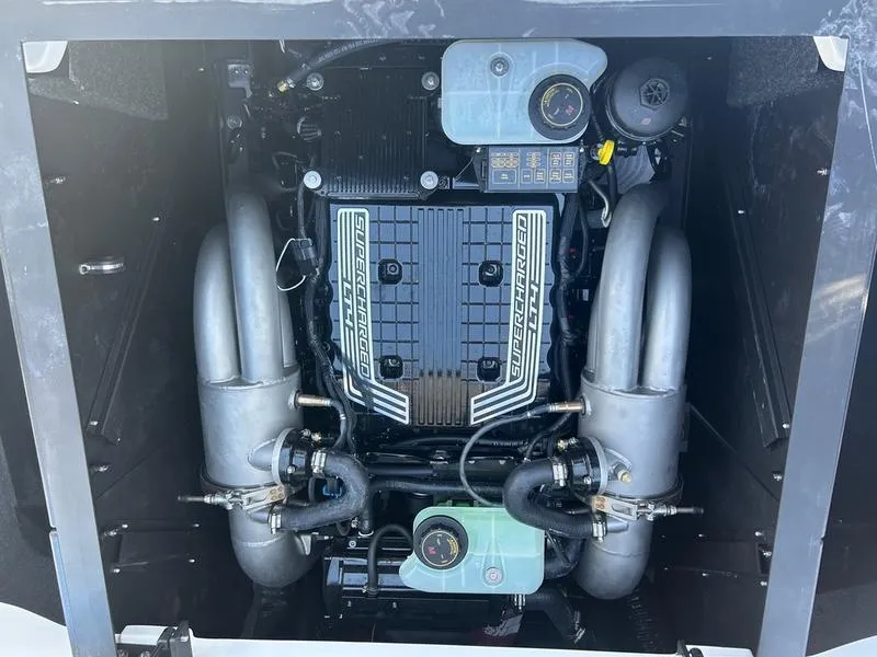 Slide: The Image of 2025 Axis T250 engine compartment with detailed components and layout. - 3