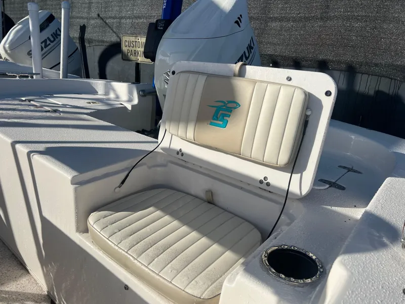 Slide: The Image of 2018 Carolina Skiff 178 DLV Series boat seat with logo and cup holder. - 5