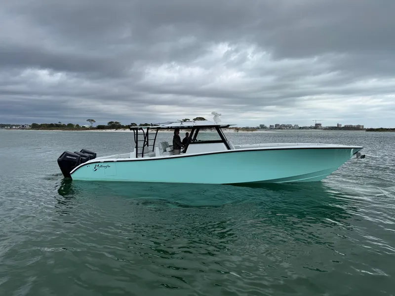 The Image of 2023 Yellowfin 42 Offshore boat on calm water under cloudy skies. - 1