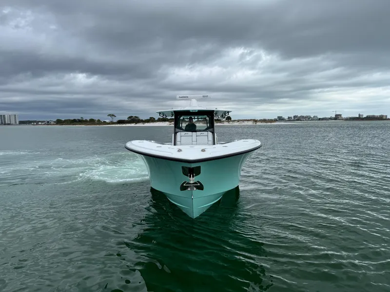 Slide: The Image of 2023 Yellowfin 42 Offshore boat on water under cloudy sky. - 10