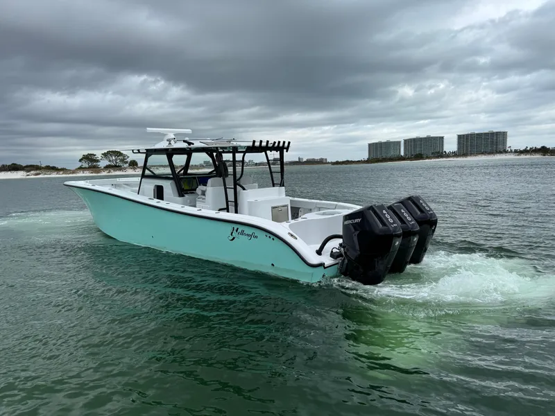 Slide: The Image of 2023 Yellowfin 42 Offshore boat cruising on a cloudy day. - 22