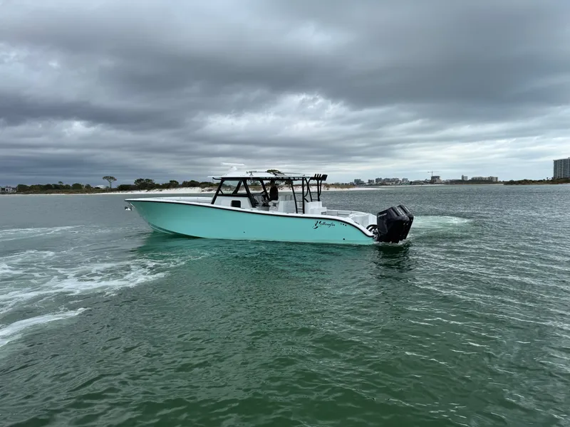 Slide: The Image of 2023 Yellowfin 42 Offshore boat cruising on a cloudy day. - 24