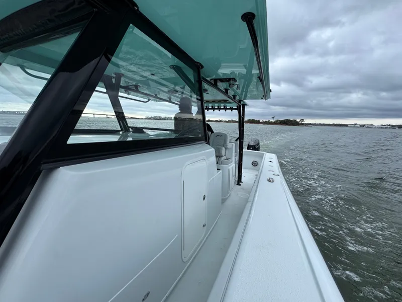 Slide: The Image of 2023 Yellowfin 42 Offshore boat cruising on a cloudy day. - 33